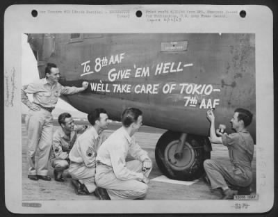 ␀ > 7Th Aaf Bomber Crew Members Approve The Meassage Painted On The Nose Of A 7Th Aaf Liberator By Sgt. Oscar T. Fomby, Bernice, La.  They Are (Left To Right) Sgt. James A. Kinney, 69 Perine St., Dansville, N.Y., S/Sgt. Wm. M. Vaughn, 2403 17Th St., Omaha, Ne