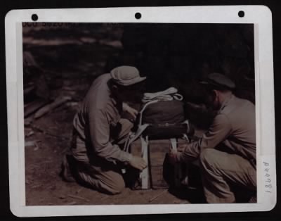 Thumbnail for ␀ > Packers Of 2Nd Troop Carrier Squadron Of 10Th Af Eastern Air Command, Attach A Parachute To 30 Cal. Ammunition Cases Which Will Be Dropped From Usaaf C-47S.  The Allied Ground Forces Are Driving The Japanese Out Of Burma So Fast That Normal Transportation