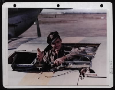 Thumbnail for ␀ > Lt. James T. Fisk, Ruppert, Idaho, Examines Flak Damage To The Wing Of His P-51. Italy.