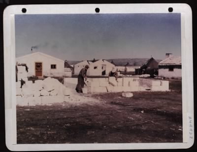 Thumbnail for ␀ > Sgt. David J. Paloazi, Chicago, Il (Left) An Italian Helper Construct A Stone Hut In Italy.