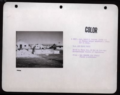 Thumbnail for ␀ > Sgt. David J. Paloazi, Chicago, Il (Left) An Italian Helper Construct A Stone Hut In Italy.