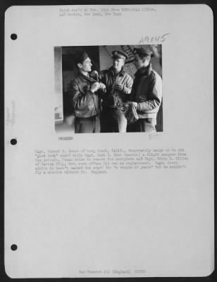 Thumbnail for Consolidated > Capt. Robert I. Green Of Long Beach, Calif., Desperately Hangs On To His 'Good Luck' Scarf While Capt. Kent N. Hunt (Center) A Flight Surgeon From San Antonio, Texas Tries To Remove The Neckpiece And Capt. Edwin H. Miller Of Carson City, Nev. Even Offers