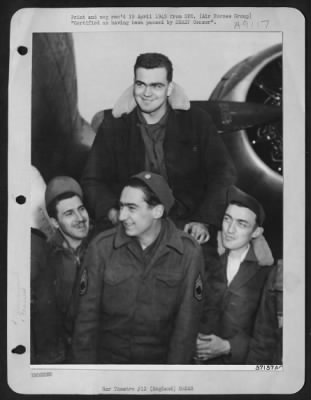 Thumbnail for Consolidated > Triumphant 100 -- Described As A 'Guy Without Nerves' By The Men With Whom He Flies, M/Sgt. Hewitt T. Dunn, Of Norfolk, Virginia, Here Is Carried From His Plane By Some Of His Friends, Following His 100Th Combat Mission.  Sgt. Dunn Became The First Bomber