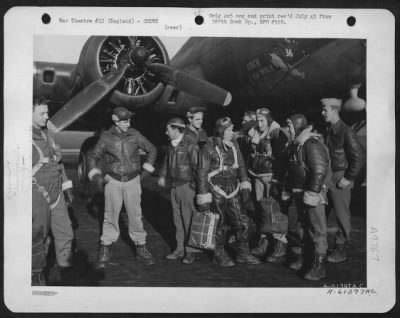 Thumbnail for Consolidated > Crew Of The 388Th Bomb Group Beside The Boeing B-17 "Flying Fortress" 'Cock O' The Walk'.  England, 26 November 1943.  Standing, Left To Right Are: 2Nd Lt. John B. Dewey, Jasper, Ohio; S/Sgt. Joseph F. Pasquale, Akron, Ohio; T/Sgt. John C. Piazza, Dorches