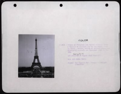 Thumbnail for Celebrations > Crowds Of Frenchmen And Allied Soldiers Watch A Display Of Aircraft Fly By The Eiffel Tower In Paris, France, During An Outdoor Exposition Displaying Aircraft And Equipment Used In The Eto.