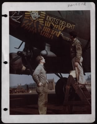 Thumbnail for Painting and Washing > Msgt Bingham Watches Sgt Pilla Paint Another Bomb On The Side Of Boeing B-17 'Idiots' Delight', Of The 8Th Air Force.  England.