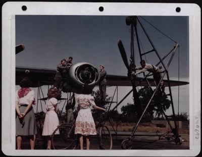 Thumbnail for General > English Girls Watching Air Mechanics Working On The Engines Of A B-24.  England.