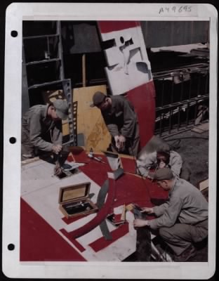 General > Sheet Metal Workers Mend A Flak Punctured Rudder Of A Consolidated B-24 In England.