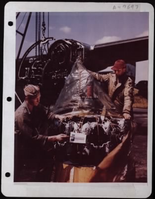 Thumbnail for General > Ground Crewmen Sgt. James V. Blakney Of Langsford, Penn., And M/Sgt. Charles W. Carrigan Of Nashville, Tenn., Make An Engine Change At An 8Th Af Base Somewhere In England.