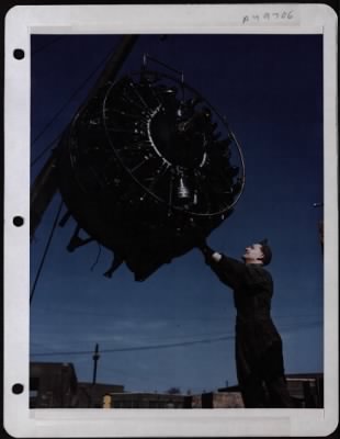 Thumbnail for General > Reconditioning Time.....Sgt. Leslie Unruh Steadies An Engine That Has Just Been Removed From A B-17 Of The 8Th Af.  It Will Be Replaced By A New Reconditioned Engine.