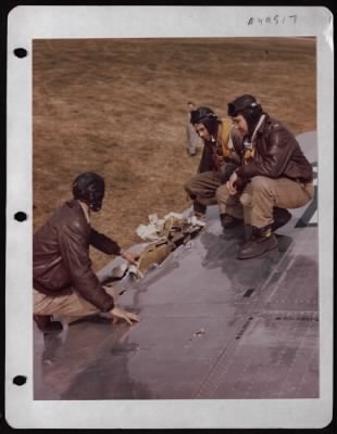 Thumbnail for Battle Damage > Crew Of The Boeing B-17 'Peacemaker' Examines Battle Damage To The Wing Of The Plane.