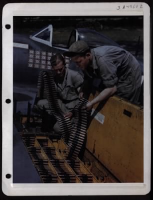 ␀ > Armament Men Must Exercise Extreme Caution In Loading .50 Cal. Machine Guns Of Plane. Extreme Caution Must Be Exercised In Loading .50 Cal. Machine Guns Of A P-47 Fighter. It May Mean The Life Of The Pilot Or Another Victory. These Men Are Experts As You