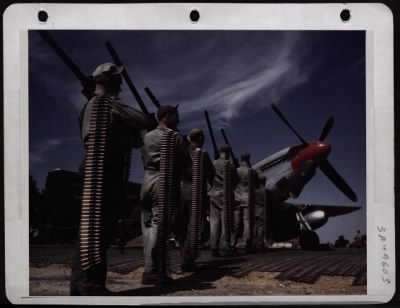 ␀ > Fire Power Of The P-51 Mustang.  These Are 6 .50 Cal. Machine Guns Used In The P-51 Mustang Fighter.  The Cartridge Belts Represent The Amount Of Ammunition Used By One Gun On A Flight.  36 Men Would Be Neede To Carry The Amount Of Ammunition As This Is O