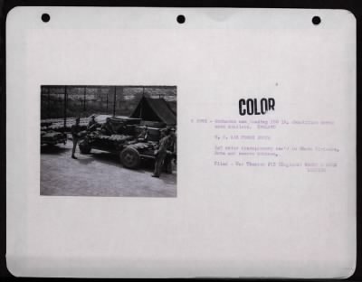 ␀ > Ordnance Men Loading 100 Lb. Demolition Bombs Onto Trailers. England.