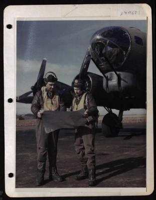 Bomber > Lt. Col. Louis G. Thorup Of Salt Lake City, Utah And 1St Lt. John A. Webb Of Detroit, Michigan Review A Course Flown Deep Into Germany.  England