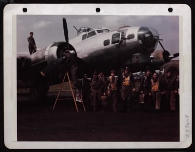 Thumbnail for Bomber > Back From Bombing An Airdrome Near Bordeaux, The Combat Crew Of The Boeing B-17 'Patsy Ann' Heads For Interrogation While Ground Crewmen Make Routine Check On Oil And Engine. Man On Wing Holds Nozzle Of Oil Hose Which Runs Up From Tank Truck. On The Ladde