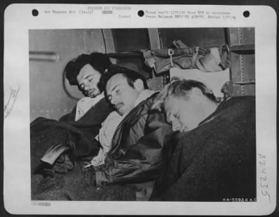 Thumbnail for Consolidated > These American airmen being evacuated from Yugoslavia sleep peacefully for the first time in many days. They had crashed in combat behind the German lines. All were aided by the Yugoslavia Resistance Movement under Marshall Tito and Gen. Mihailovitch