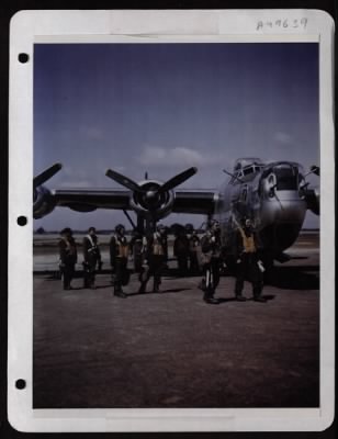 Thumbnail for Bomber > Capt. Howard Slaton, Pilot, And His Crew Leave Their Consolidated B-24 At A Base Somewhere In England After A Mission Over Berlin.