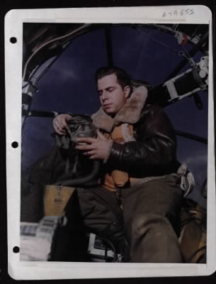 Thumbnail for Bomber > Capt. Louis Detoni Adjusts His Oxygen Mask In Preparation For Coming Mission Against Enemy Installations. Photograph Unknown.