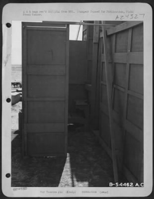 Thumbnail for Consolidated > ITALY-A view backstage reveals an entrance to the stage next to the door leading to the dressing rooms. With this added inspiration, the entertainers put forth their best efforts.