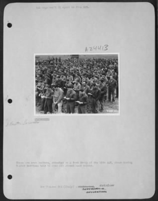 Thumbnail for Consolidated > These are crew members, attached to a Bomb Group of the 15th AAF, shown during Easter Services held in open air church near runway.