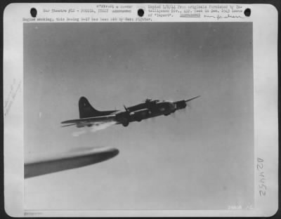 Thumbnail for Consolidated > Engine smoking, this Boeing B-17 has been hit by Nazi Fighter.