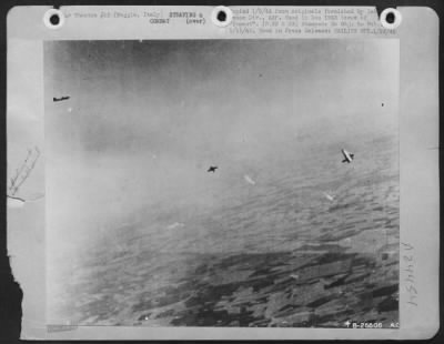 Thumbnail for Consolidated > This U.S. Army 15th Air Force B-17 bomber (right) has just lost one wing over Foggia, Italy, and two of its crew can be seen bailing out. At left is an enemy fighter plane.