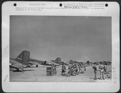 Thumbnail for Consolidated > Troop carrier planes of the NAAF bring additional supplies and personnel to Italy. The wounded were evacuated on the return trip.