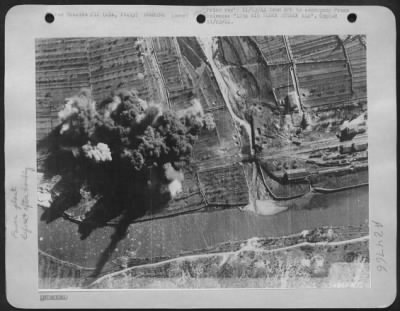 Thumbnail for Consolidated > 12TH AIR FORCE ATTACKS ALA-This combat photograph was taken at the height of a B-25 bombing attack by the U.S. Army 12th Air Force on the electric power transformer at Ala, 25 miles north of Verona in Northern Italy. The attack, which produced