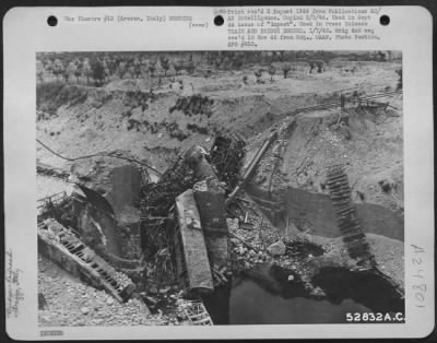 Thumbnail for Consolidated > TRAIN AND BRIDGE BOMBED-More effective than bombing a bridge is destruction of the span while a train is on it. U.S. Army Air Force bombers and fighters attempt to catch trains on bridges then straddle them with bombs. This troop train was destroyed