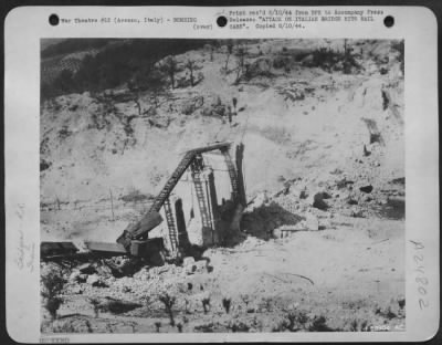 Consolidated > Lying where they fell, these rail cars were on the receiving end of Mediterranean Allied Air Force bombs during a raid on this rail bridge of the Arezzo-Florence railroad line in Northern Italy. The operations were part of the campaign to choke off