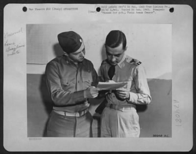 Thumbnail for Consolidated > Left, Maj. Walter Maciey From Frackville, Pa., An American Liaison Officer With The First Brazilian Fighter Squadron, Discusses The Target For The Day With Capt. Francisco Dutra Sabroza From Rio De Janeiro.  Capt. Sabroza Is A Graduate Of Brazil'S West Po