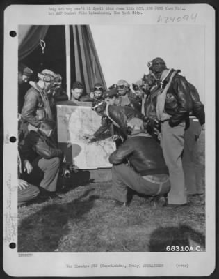 Thumbnail for Consolidated > Lt. Clinton Owen Of Alva, Oklahoma Tells Captain Shapiro Of Brooklyn, Massa., 87Th Fighter Squadron Intelligence Officer, How He Shot Down 2 Fw-190'S And Points To The Location On The Map.  79Th Fighter Group, Capodichino, Italy.