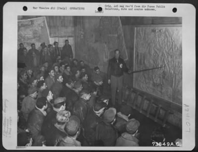 Consolidated > Capt. Charles Bowman, Uniontown, Pa., 450Th Bomb Group, Briefing Crew Members At An Airbase In Italy.  3 December 1944.