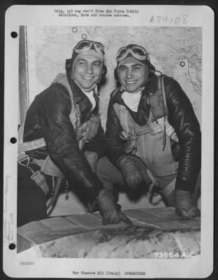 Thumbnail for Consolidated > Left To Right: 2Nd Lt. Earl Shonkin And His Twin, 2Nd Lt. Courtney Shonkin, Of Chicago, Ill., With The 450Th Bomb Group, Study A Map Before Taking Off On A Mission Over Enemy Territory.  Italy, 3 December 1944.