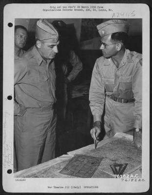 Consolidated > Major General Nathan F. Twining Studies A Map At A 90Th Photo Reconn Wing Base Somewhere In Italy.