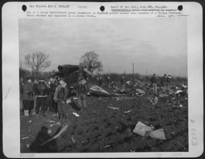 Thumbnail for Consolidated > Men Of A Heavy Bombardment Group Somewhere In England Gather Around What Remains Of A "Flying Fortress" Which Crashed And Exploded In A Plowed Field.