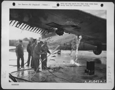 Consolidated > Fire Fighters Use Foamite To Extinguish Flame In The Wing Of A Boeing B-17 Flying Fortress.  303Rd Bomb Group, England.  20 October 1944.