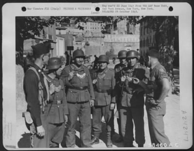 Consolidated > Lt. Colonel Jack Nicholas Of St. Joseph, Missouri, And Sgt. Theodore B. Miller Of Balsam Lake, Wisc., Talk With German Mps In Trento, Italy.  [The Armed German Mps Are Wearing Thier Distinctive Police Gorgets Around Their Necks.]