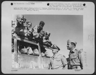 Thumbnail for Consolidated > Left To Right: Major General Nathan F. Twining, Commanding General Of The 15Th Air Force, And Brig. Gen. H.C. Rush [Of The 47Th Wing], Chat With Their Men After Release From Bulgarian Prison Camps.  17 Sept. 1944.