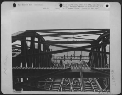 Thumbnail for Consolidated > The Recurring Newspaper Phrase '9Th Af Medium Bombers Disrupted Enemy Rail Communications' Is Illustrated By This Photo Of The Bad Munster Rail Bridge After An Attack By Martin B-26 Marauders Of Major General Samuel E. Anderson'S 9Th Bomb. Div.  The Struc