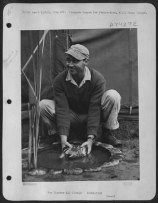 Thumbnail for Consolidated > Who'S Giving Who A Bath?  Cpl. John W. Powers Of Rockmart, Georgia, Seems To Be On The Recieving End Of An Irate Duck.  He Decided To Give 'Deedee', His Pet, A Bath At His 15Th Air Force Base, But 'Deedee' Sort Of Resented It.  Italy. Or You Can Lead A Du