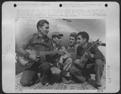 Thumbnail for Consolidated > Sometimes The Sweating Out Ordeal Takes The From Of A Little Close Harmony.  A Song That Will Take Them Completely Away From Their Work, Something Like 'Nothing Can Stop The Army Air Corps'.  Left To Right Are, Pfc. Henry A. Crete, 24, 1310 Randall S., Be