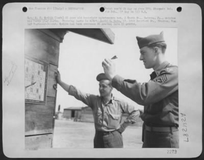 Thumbnail for Consolidated > Sgt. K.F. Sydlik (Left) 21 Year Old Bombsight Maintenance Main, 2 South St., Natrona, Pa., Watches His Buddy Play Darts.  Throwing Darts Is S/Sgt. David M. Mabe, 19, 1012 Crawford St., Houston, Texas, Aaf Engineer-Gunner.  Sydlik Has Been Oversears 20 Mon