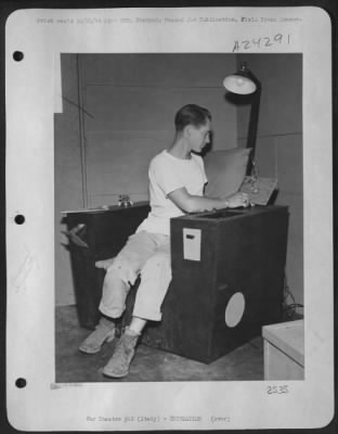 Thumbnail for Consolidated > Sgt. Ray Petit, 24, Cambridge Springs, Pa., A Radio Mechanic, 15Th Af Based In Italy, Is Shown Sitting In An Ultra Easy Chair Which He Built From Belly Tank Crates.  It Has Built-In Ash Trays, Radio, Reading Light, Magazine Rack, Compartments, Adjustable