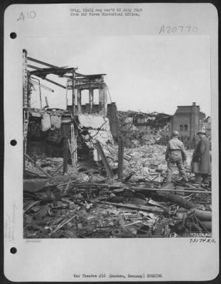 Consolidated > The Krupp Grusonwerk Armament Factory At Buckau, Germany (85 Miles Southwest Of Berlin) Was Repeatedly Bombed By Us 8Th Af.  Here A Member Of The 105Th Combat Engineers Is Directed By A Factory Employee Thru The Bombed Buildings, Searching For Steel Secti