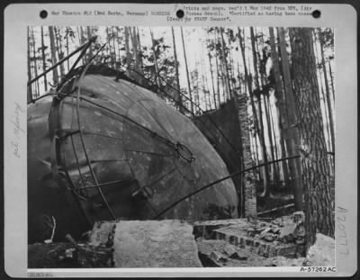 Thumbnail for Consolidated > One Of The Many Huge Luftwaffe Oil Storage Tanks, At Bad Berka, Germany, Tipped Over Heavily On Its Side, And The Protective Brick Side Wall Partially Demolished.  A Direct Bomb Hit Caused The Tip Over.