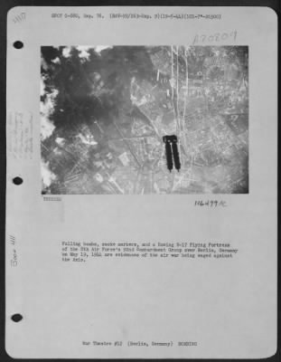 Thumbnail for Consolidated > Falling Bombs, Smoke Markers, And A Boeing B-17 "Flying Fortress" Of The 8Th Air Force'S 92Nd Bombardment Group Over Berlin, Germany On May 19, 1944 Are Evidences Of The Air War Being Waged Against The Axis.