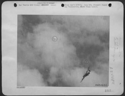 Thumbnail for Consolidated > This Striking Aerial Photograph Was Snapped By An Alert Combat Crew Cameraman, Sgt. Max Shapoff, Of New York City, As One Of The 15Th Aaf Consolidated B-24 Liberators Crashed Somewhere In German-Held Territory.  The Ship, Hit By Flak, Continues Its Descen