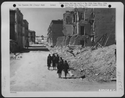 Thumbnail for Consolidated > On Their Way To Work, Wacs Walk Past Buildings Shattered By Bombs Of Their Own Aaf When That Part Of Italy Was In German Hands.  The Wacs Are Members Of A Platoon Assigned To The 12Th Air Force Headquarters.